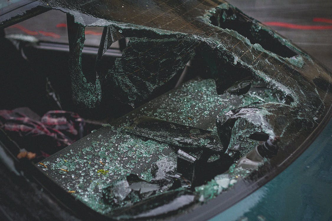 A caved-in windshield of a car